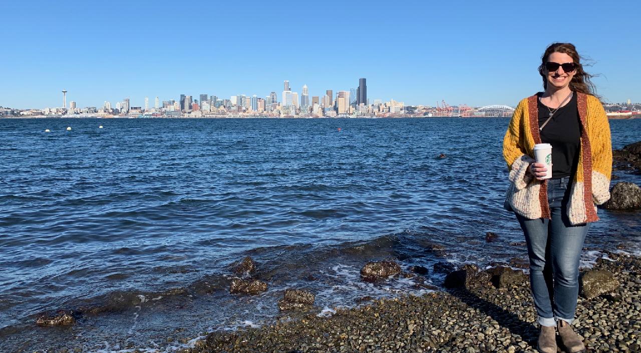 Laura in front of the Seattle skyline