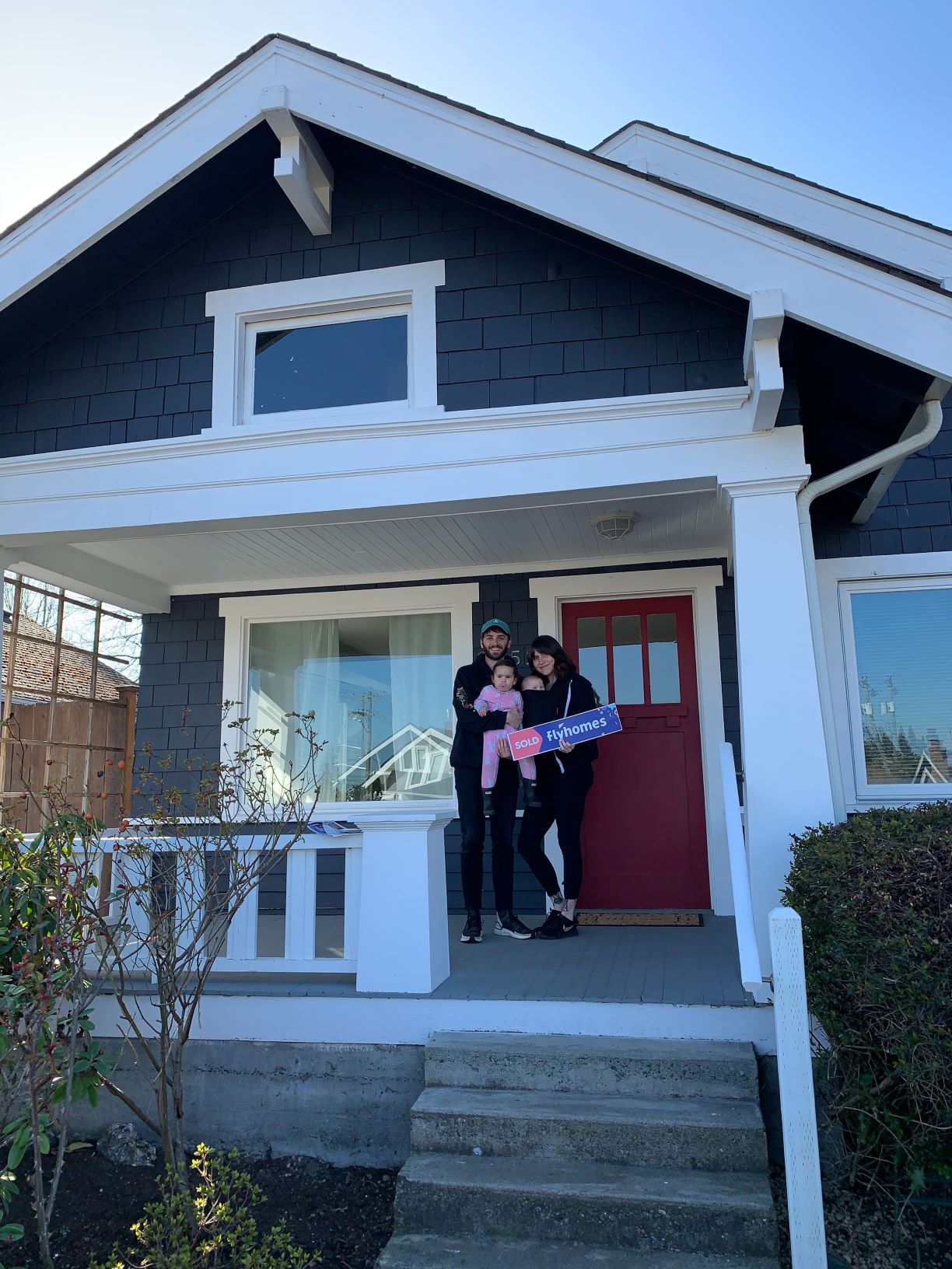 Kyle and Drew on the steps of their house