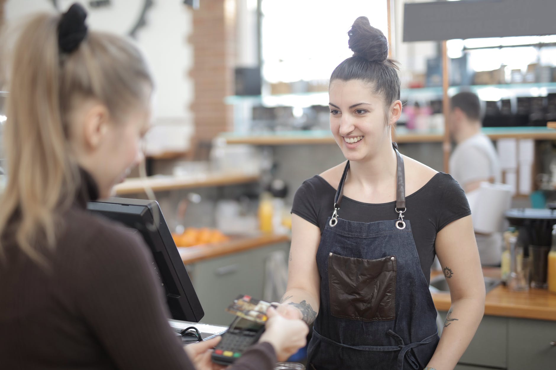 woman paying with credit card
